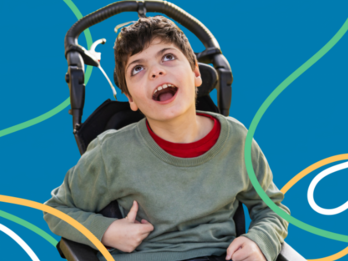 A young boy using a wheelchair